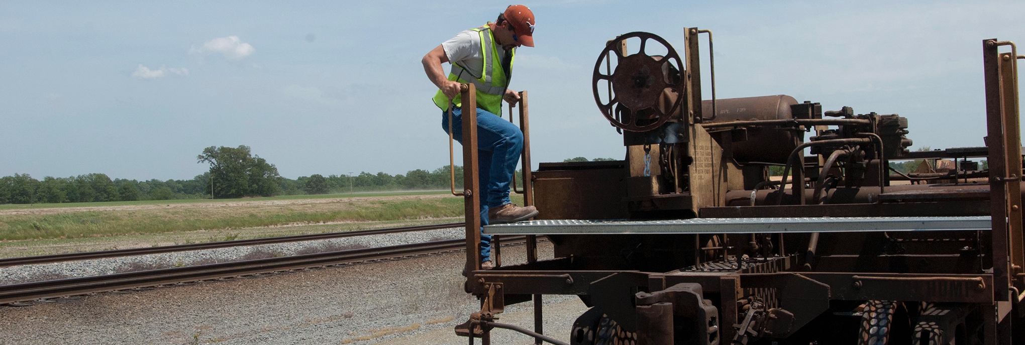 Railroad conductor staffed to examine rail equipment