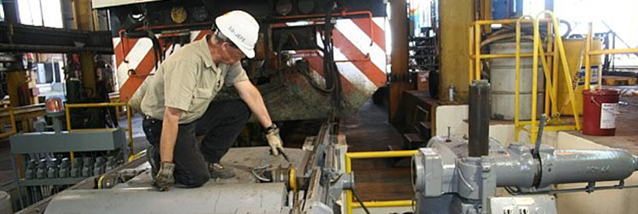 locomotive mechanic fixing locomotive equipment in maintenance shop