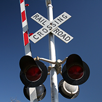 Railroad crossing signal maintained by rail staff signal maintainer