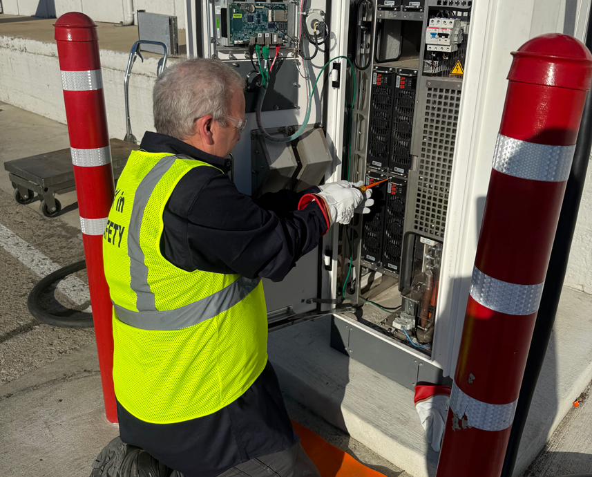 Hallcon EVOne® certified EV infrastructure technician servicing EV charger