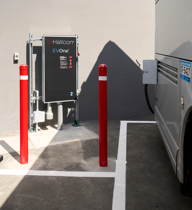 Hallcon branded EV switch next to motorcoach